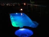 Image of an In-ground Fiberglass Pool Installation Illuminated by Built-in Lightning System in Oakville