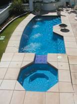 Image of a Modular In-ground Fiberglass Pool with a Spillover Spa in Oakville