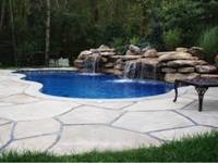 Image of Fiberglass Pool Installation With A Rock Formation Waterfall and a Pacific Blue Finish in Toronto