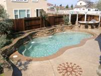 Image of Backyard in London With A Fiberglass Pools Installation Customized with the Pebble Beach Pools Finish