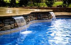Image of an In-ground Fiberglass Pool Complemented by Inlayed Tiles