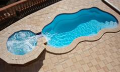 Image of an In-ground Pool with Spill-Over Spa Finished with the Viking Blue Gel Coat Finish