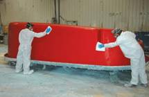 Image of Interpools' Employees Preparing the Mold for a Fiberglass Pool